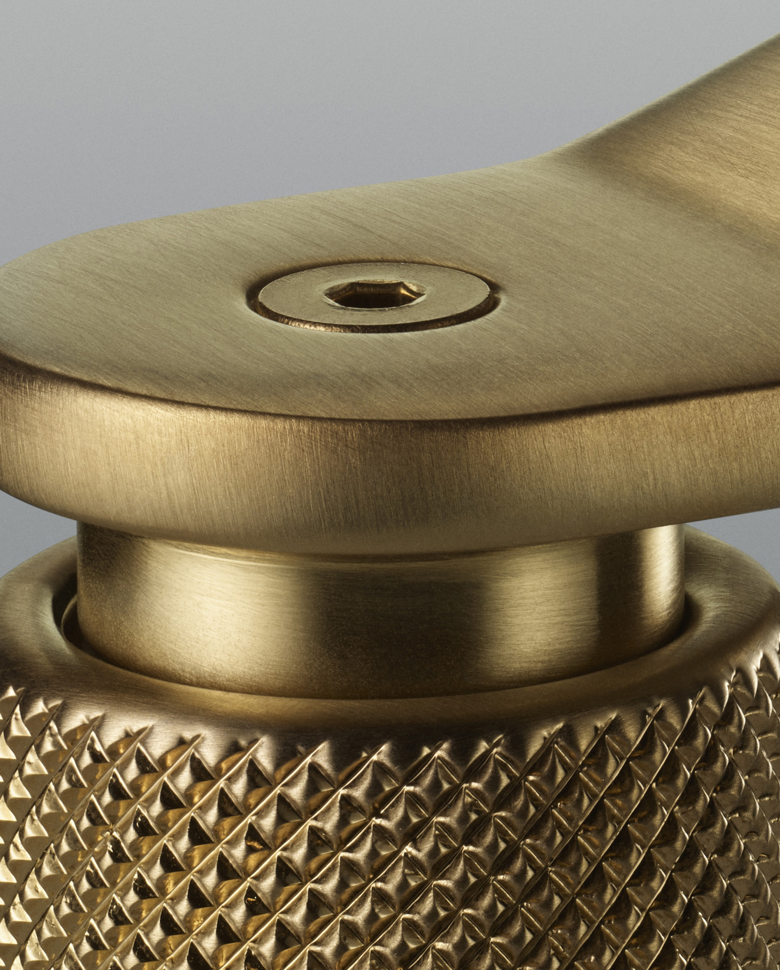 Close detail of a knurled brass faucet handle