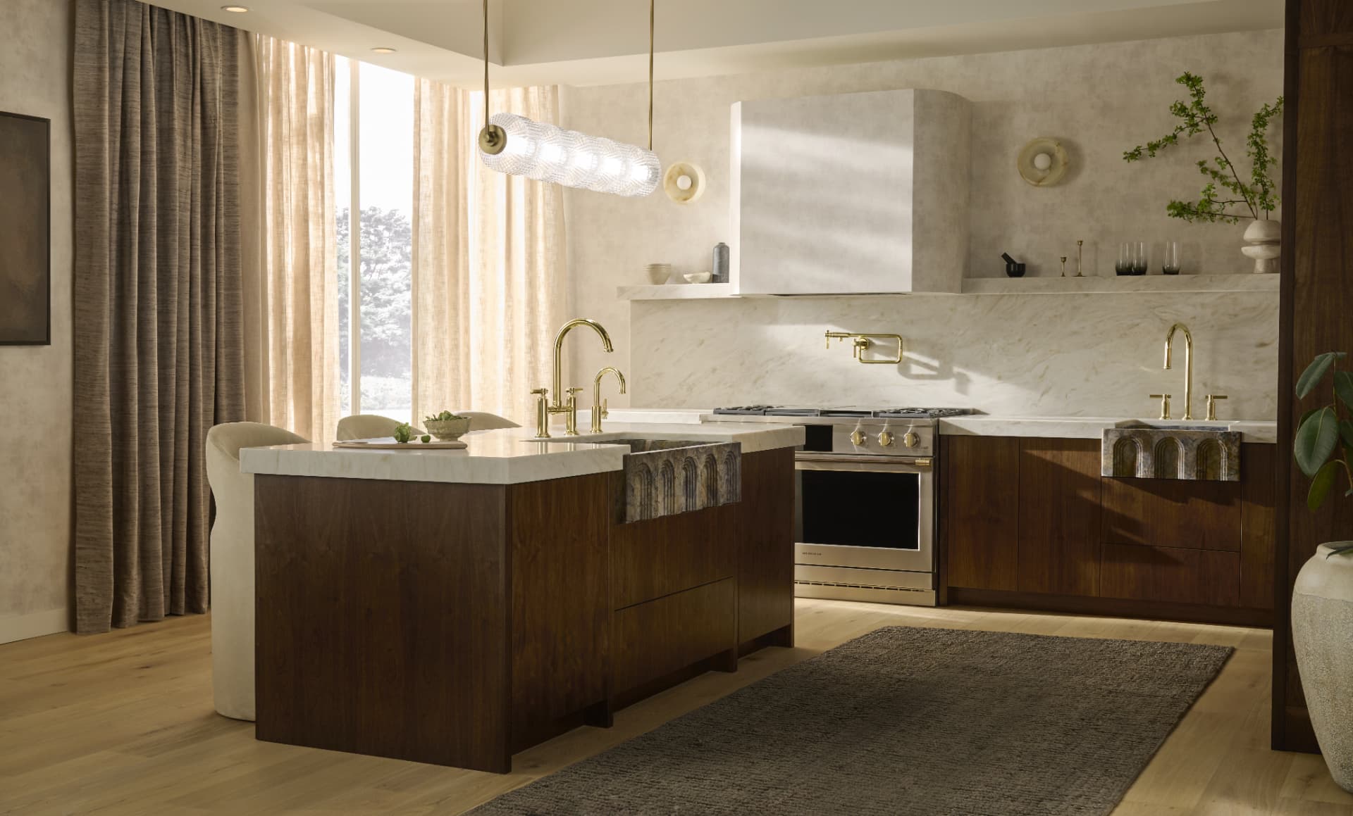 Sunlit walnut kitchen with fluted glass pendant and marble backsplash