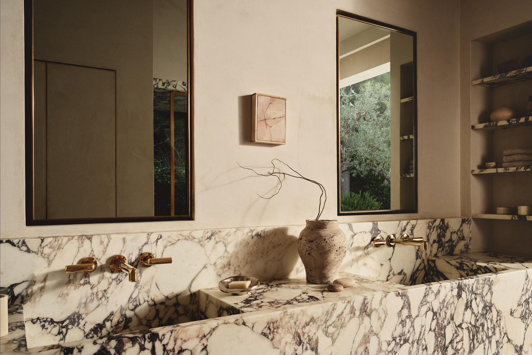 Plaster bathroom with Calacatta Viola marble trough sinks and unlacquered brass fittings